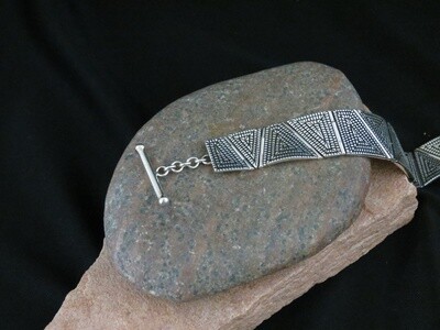 Basket weave pattern link bracelet designed by Elgin Tom