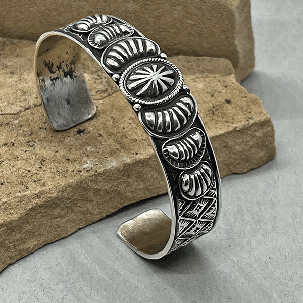 Bracelet w/ heavy stamp work by Tsosie White
