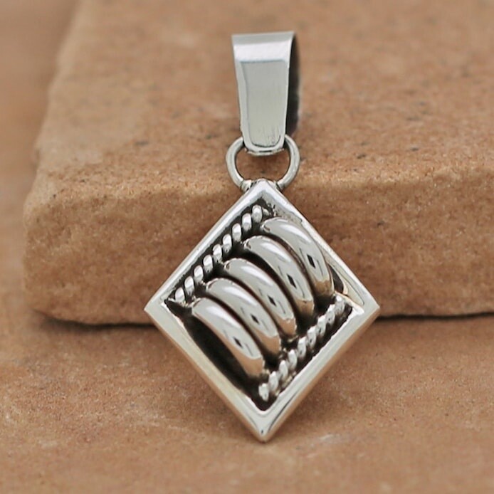 Navajo artist Tom Charley pendant