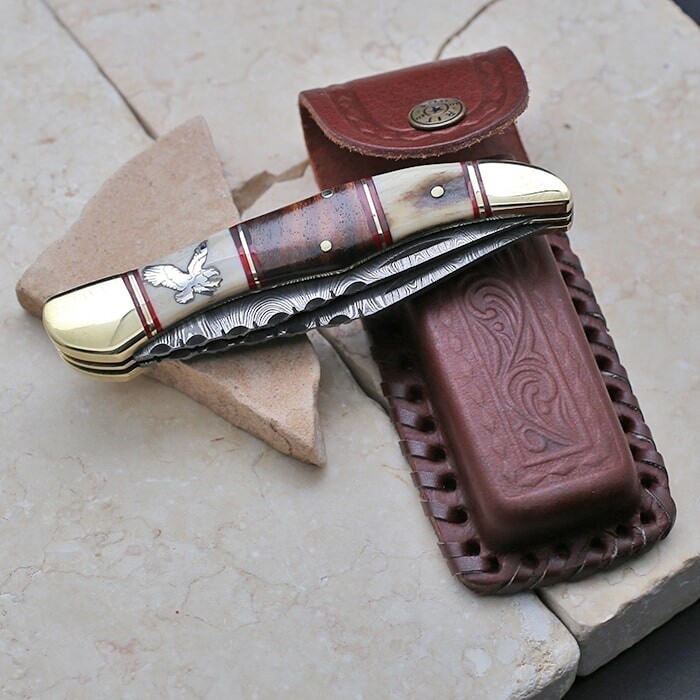Damascus steel double blade knife w/eagle image