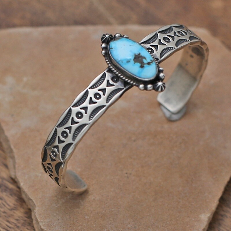 Heavy stamped bracelet w/golden hills turquoise