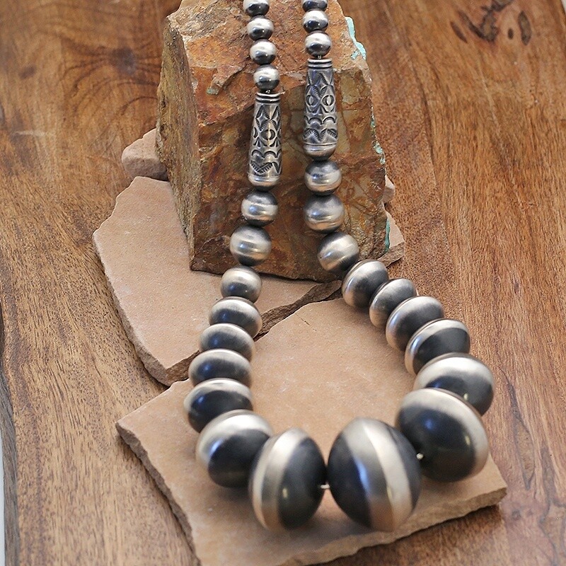 Large graduated Navajo pearls w/stamped barrel beads