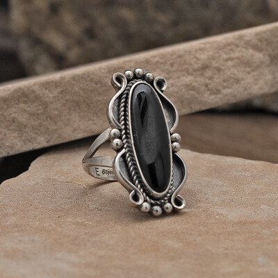 Elongated black onyx ring w/ curved setting
