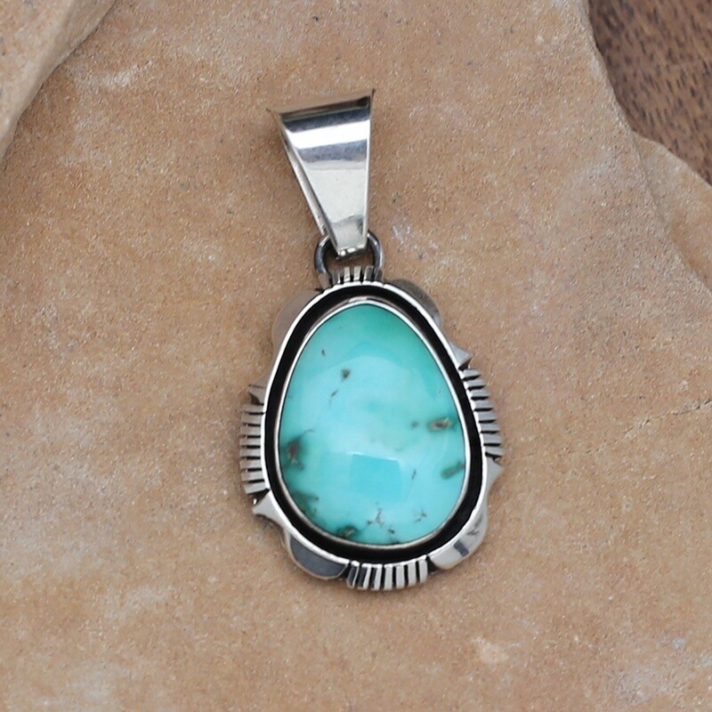 Turquoise pendant w/ triangle wire setting.