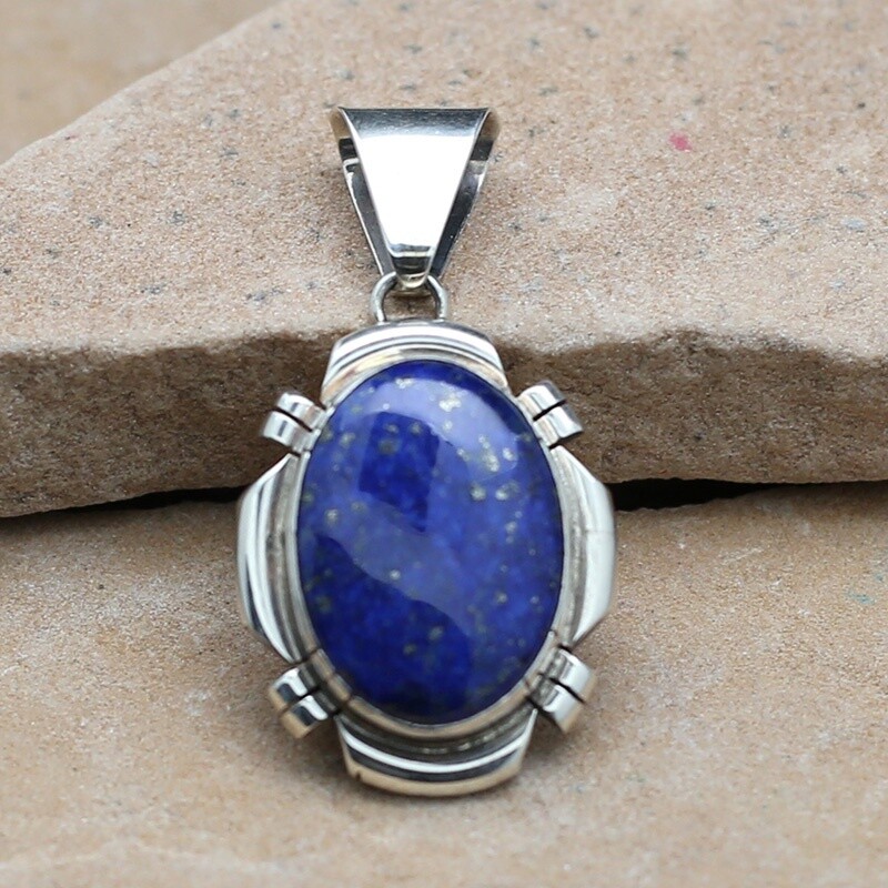 Lapis pendant with saw cut details