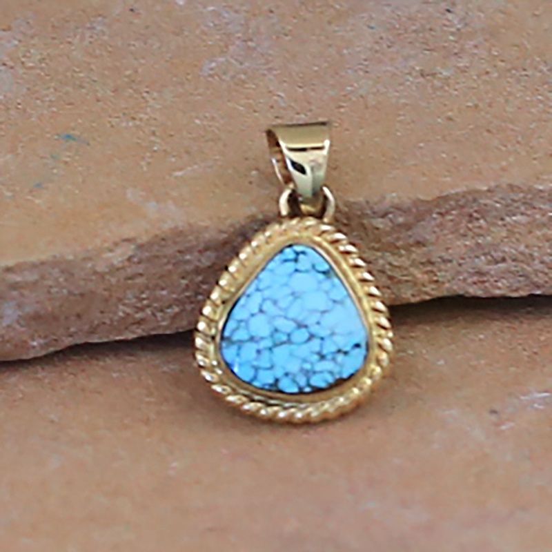 Mini 14kt gold pendant w/ lite blue kingm