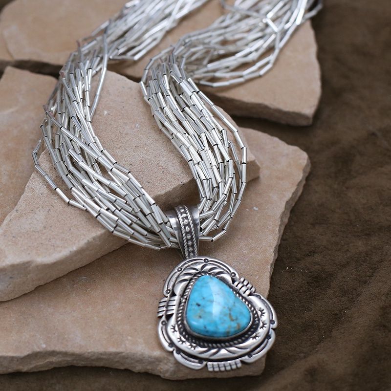 Pawn jewelry- 19 strand liquid silver necklace w/pendant