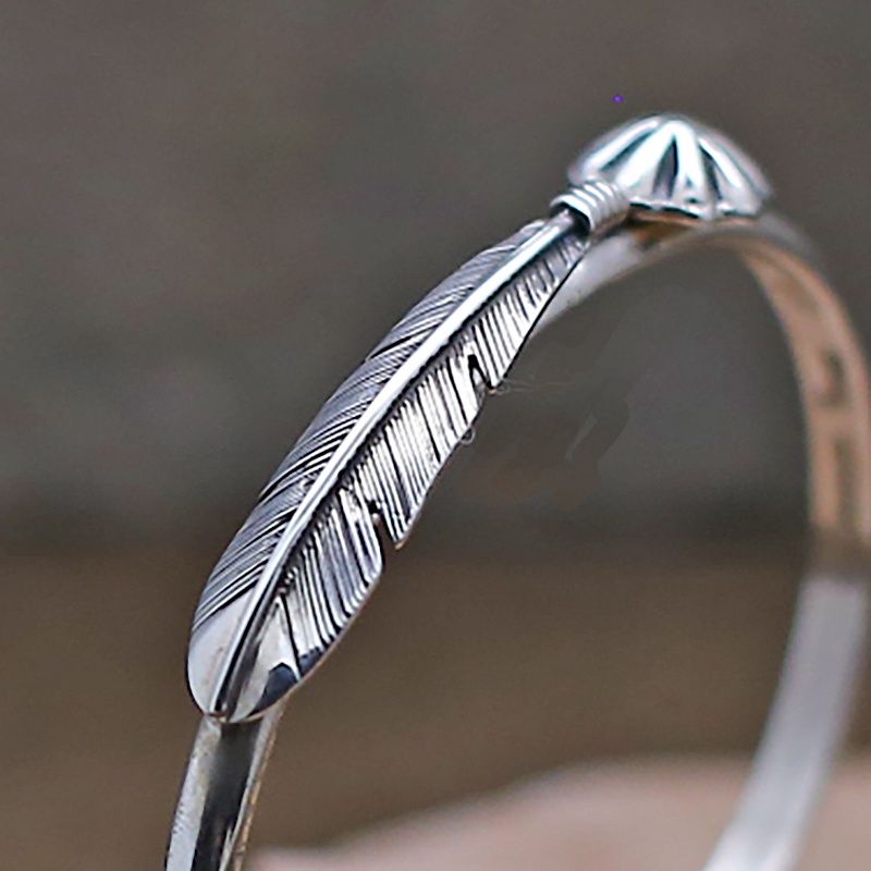 Thin feather bracelet w/ concho design