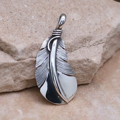 Large curved feather pendant designed by artist Lena Platero