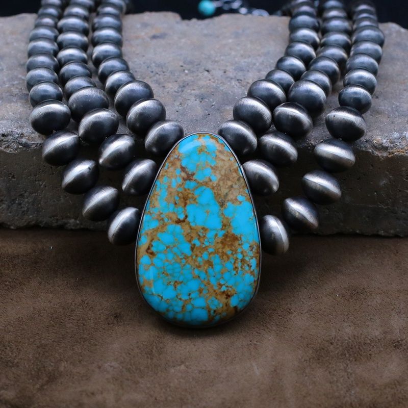 Extra large turquoise pendant with graduated beads