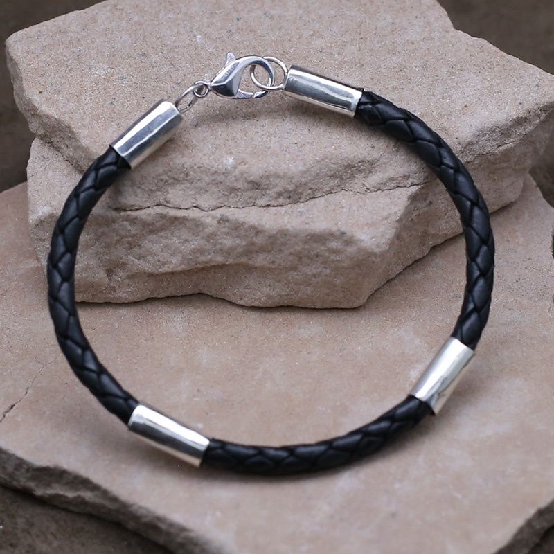 Black leather cord bracelet w/ silver accents