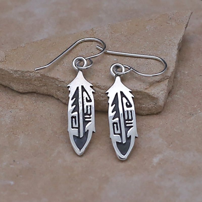 Small feather dangle earrings w/ southwest overlay design