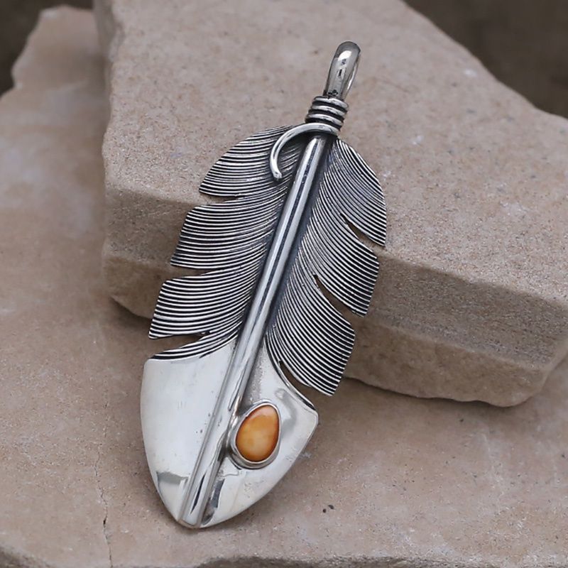 Feather pendant with orange spiny oyster shell