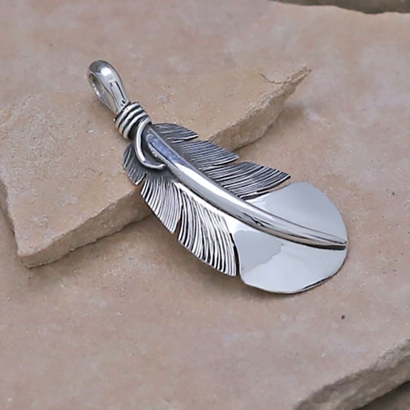 Medium sized curved feather pendant