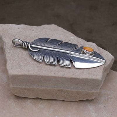Feather pendant with orange spiny oyster shell
