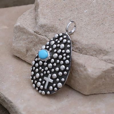 Tear drop shaped pendant designed by artist Akee Douglas