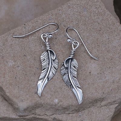 Curved feather dangle earring