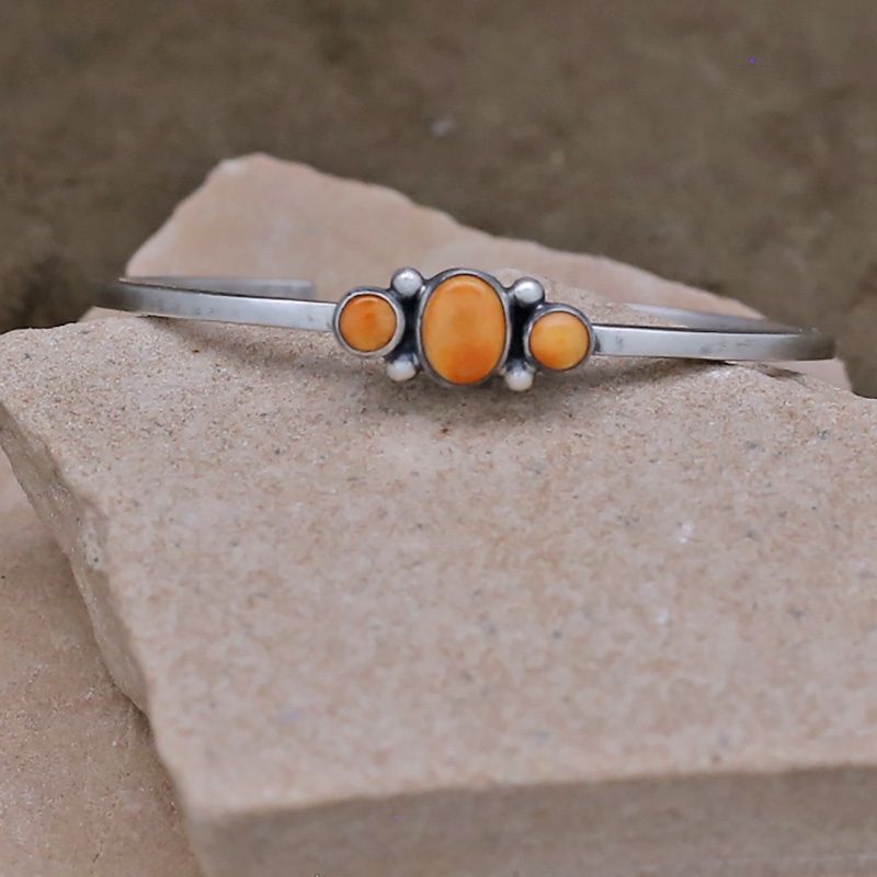 3-stone silver bracelet w/ orange spiny oyster shell
