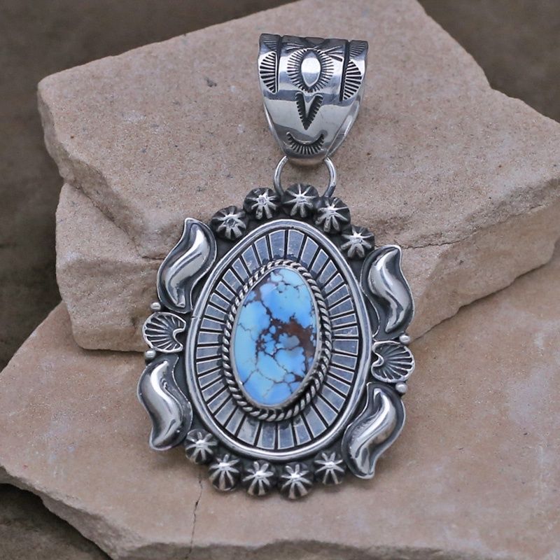 Heavy stamped Navajo pendant by artist Rick Tolino