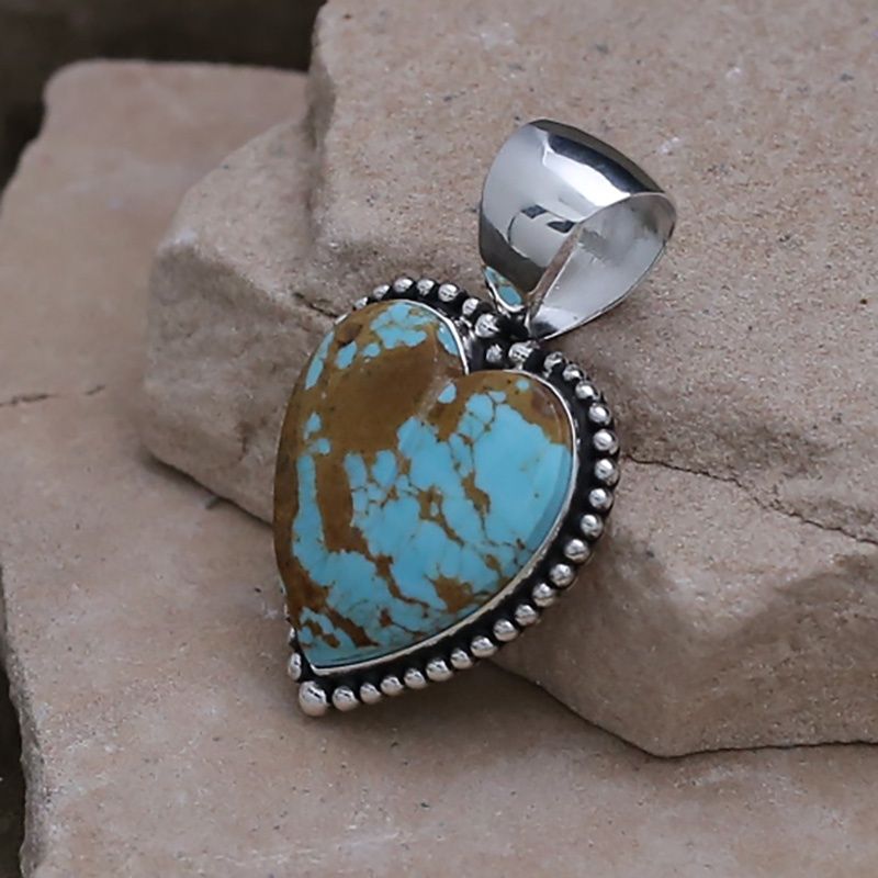 Turquoise heart pendant w/ bead surround