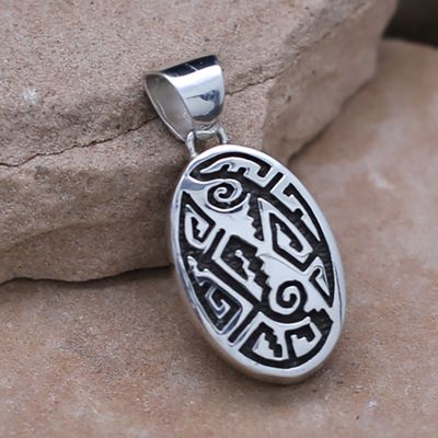 Oval reversible pendant w/Adobe pueblo design