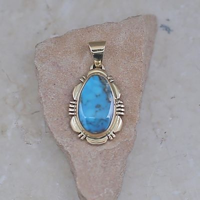 14kt gold Bisbee turquoise pendant by artist Rick Tolino