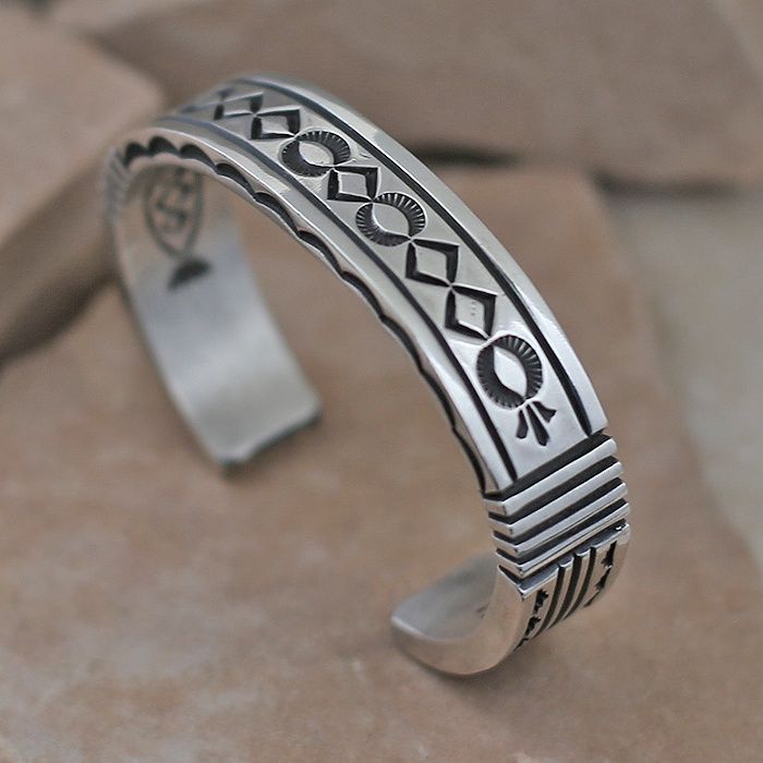 Heavy stamped silver bracelet by Albert Jake