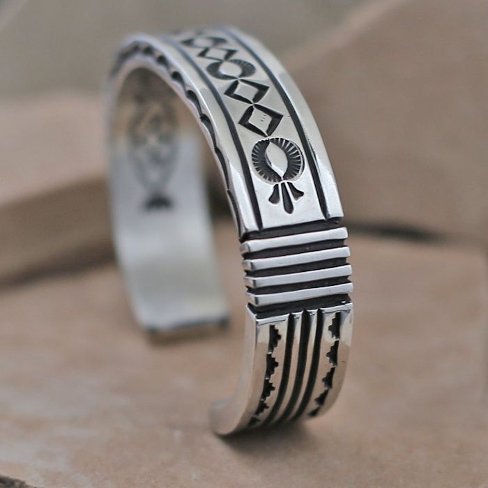 Heavy stamped silver bracelet by Albert Jake