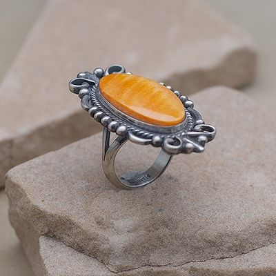 Silver scroll design spiny oyster shell ring