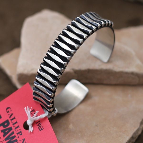 Large silver bracelet by Navajo artist Leander Tahe