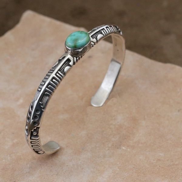Navajo cast silver bracelet w/ Sonoran turquoise