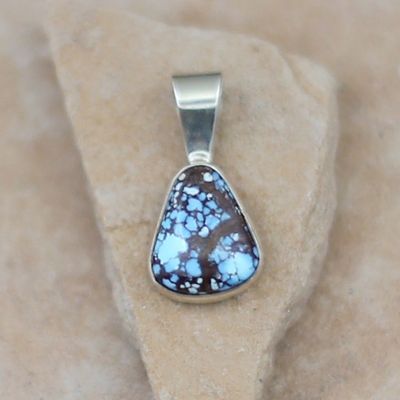 Small triangle shape pendant w/ Golden Hills turquoise