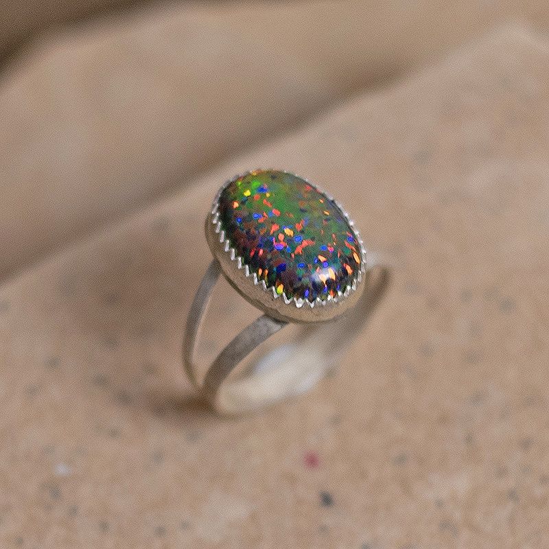 Oval dark orange cultured opal ring w/ split wire shank