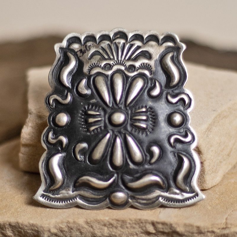 Stamped pendant by Leander Tahe