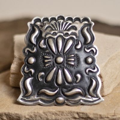 Stamped pendant by Leander Tahe