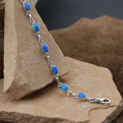 Small oval link bracelet w/ blue cultured opal