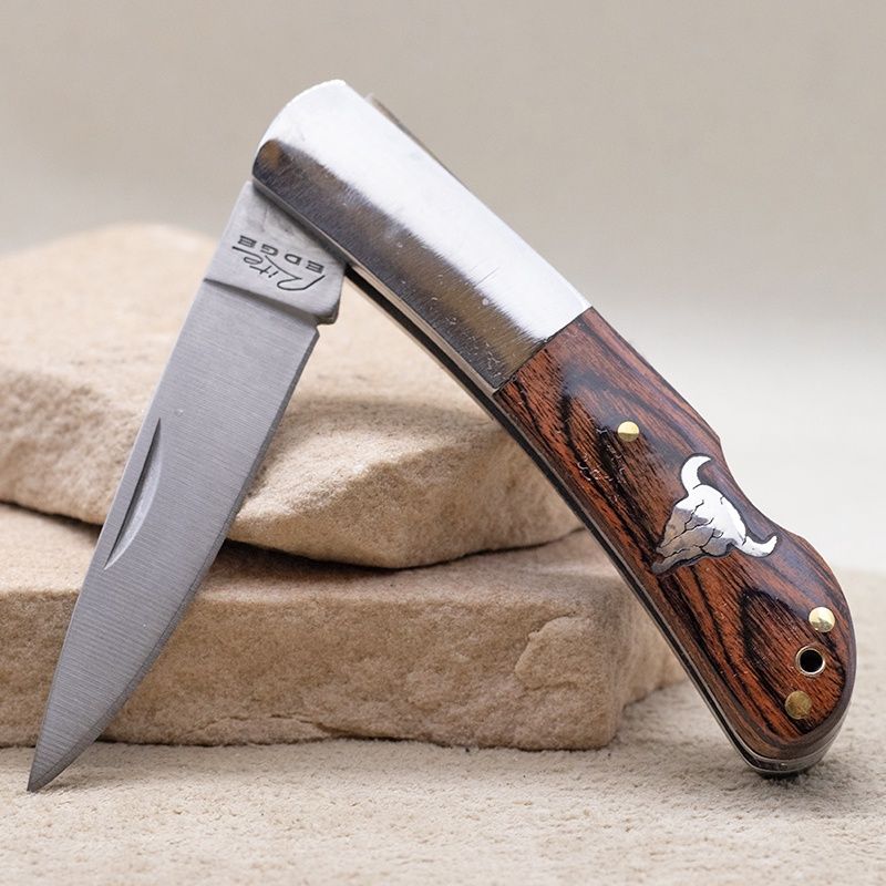 Small pocket knife w/ Cow skull inlay
