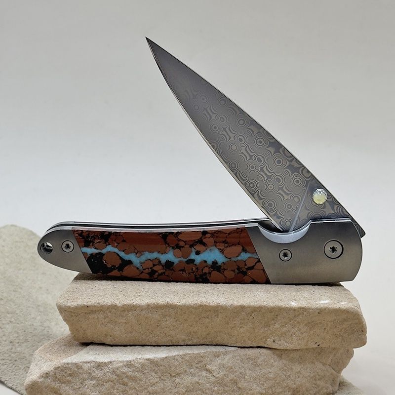 Damascus folding knife with boulder turquoise inlay