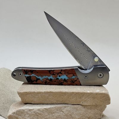 Damascus folding knife with boulder turquoise inlay