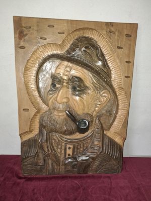Visser in hout uitgesneden