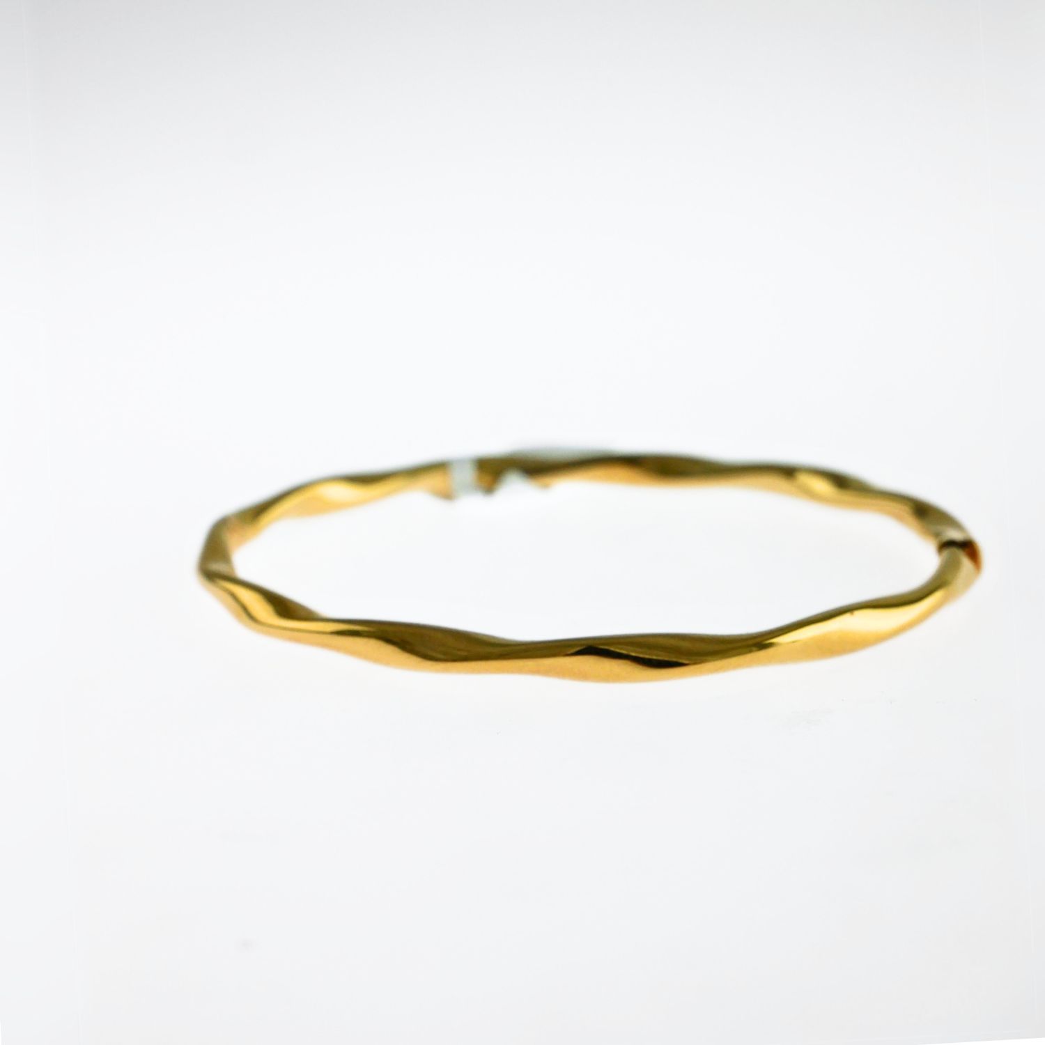 POLISHED TWIST BANGLE