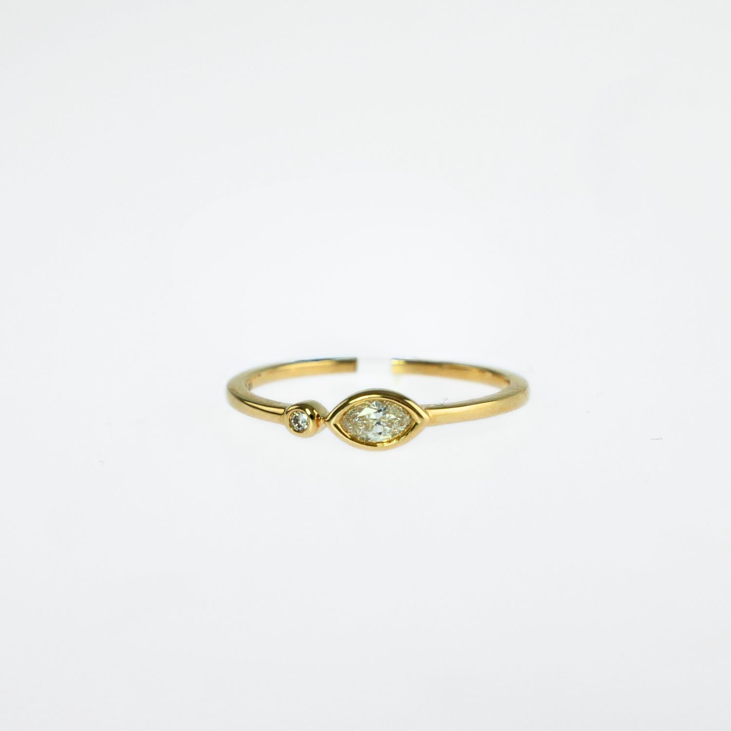 ROUND AND MARQUISE-SHAPE DIAMOND RING