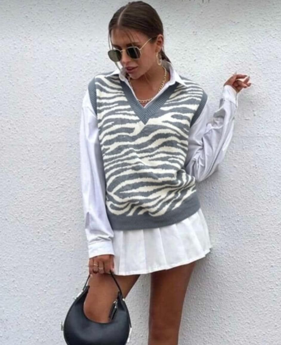 Pull sans manches gris et blanc