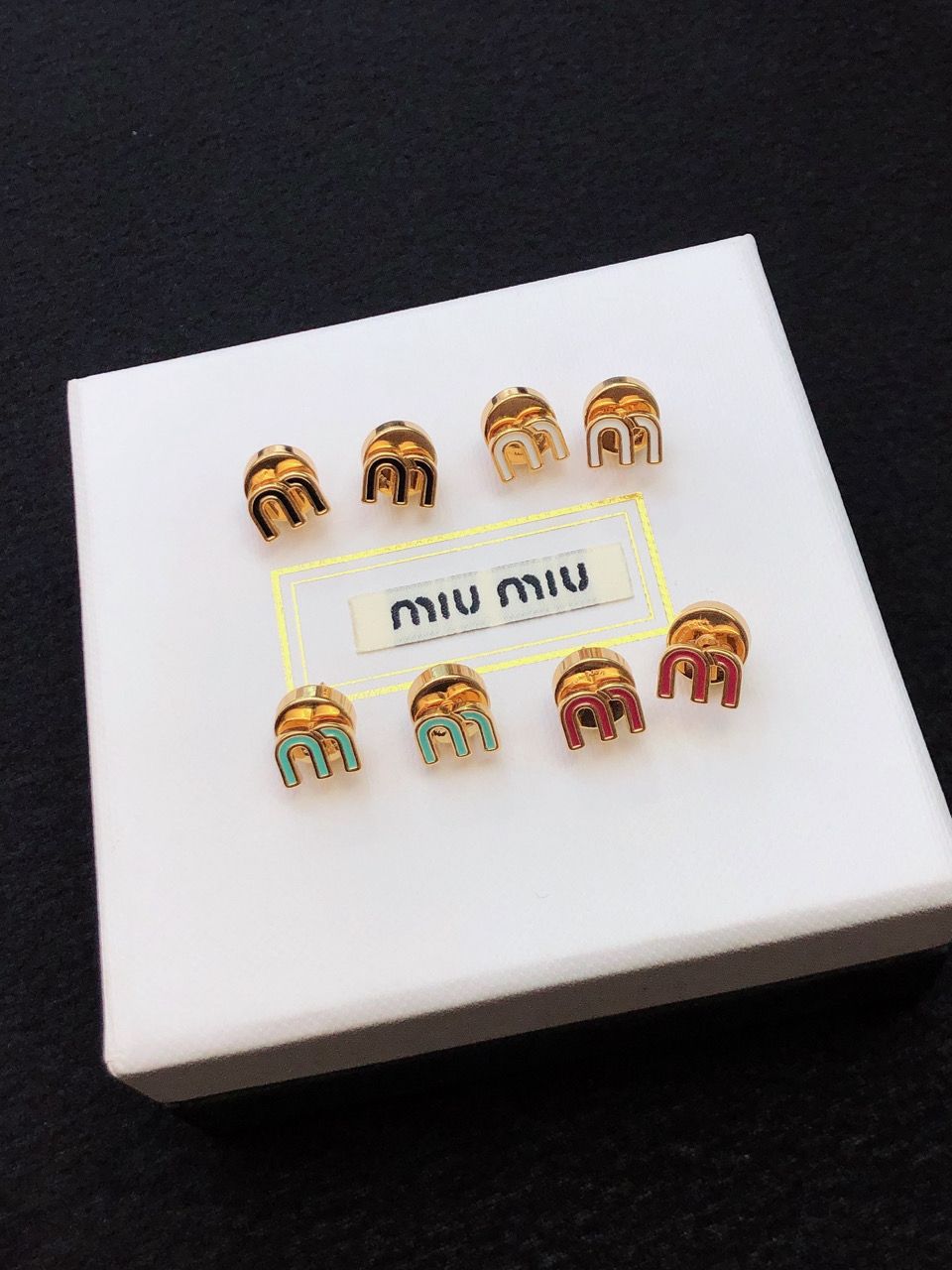 Orecchini M miu