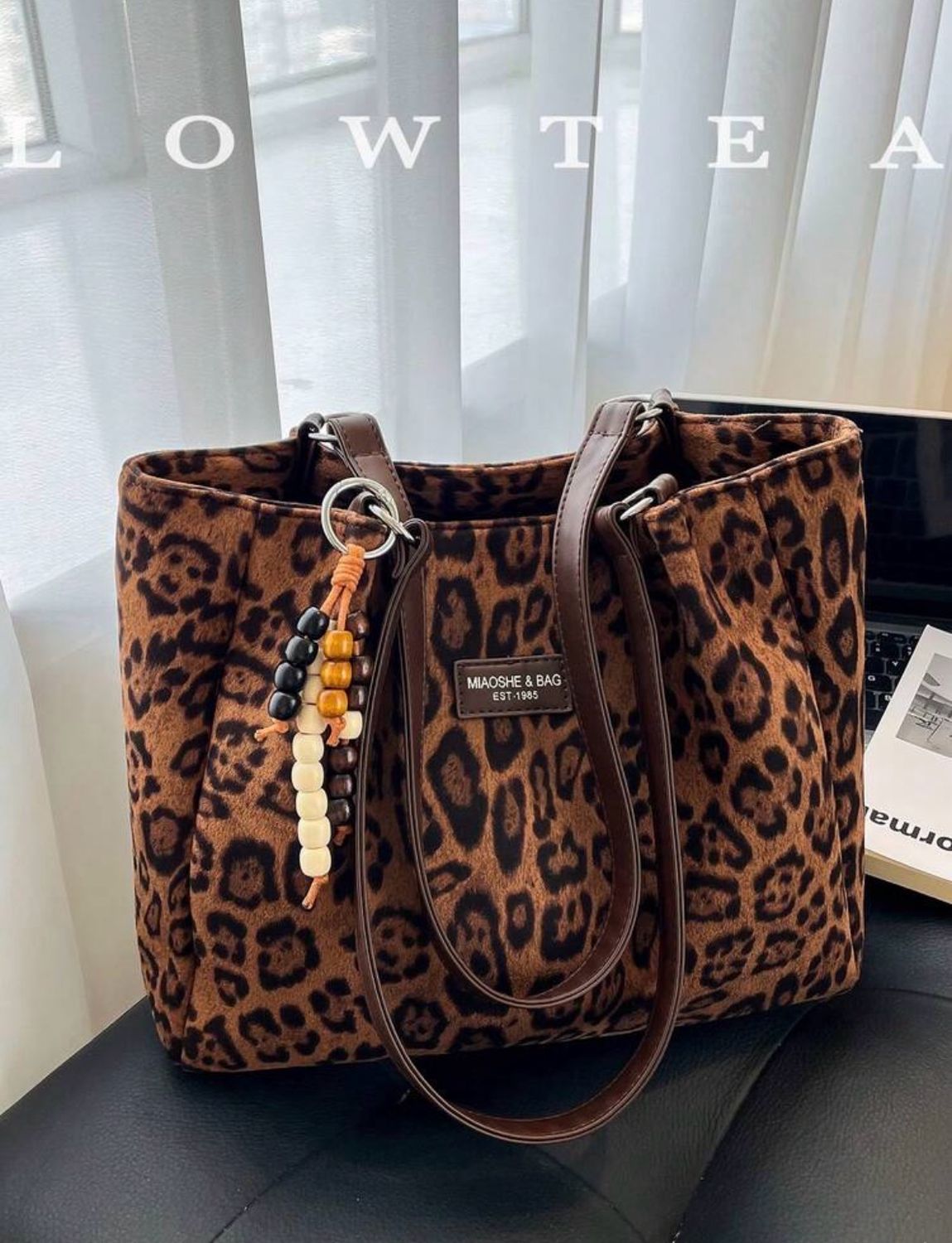 Cartera marrón animal print