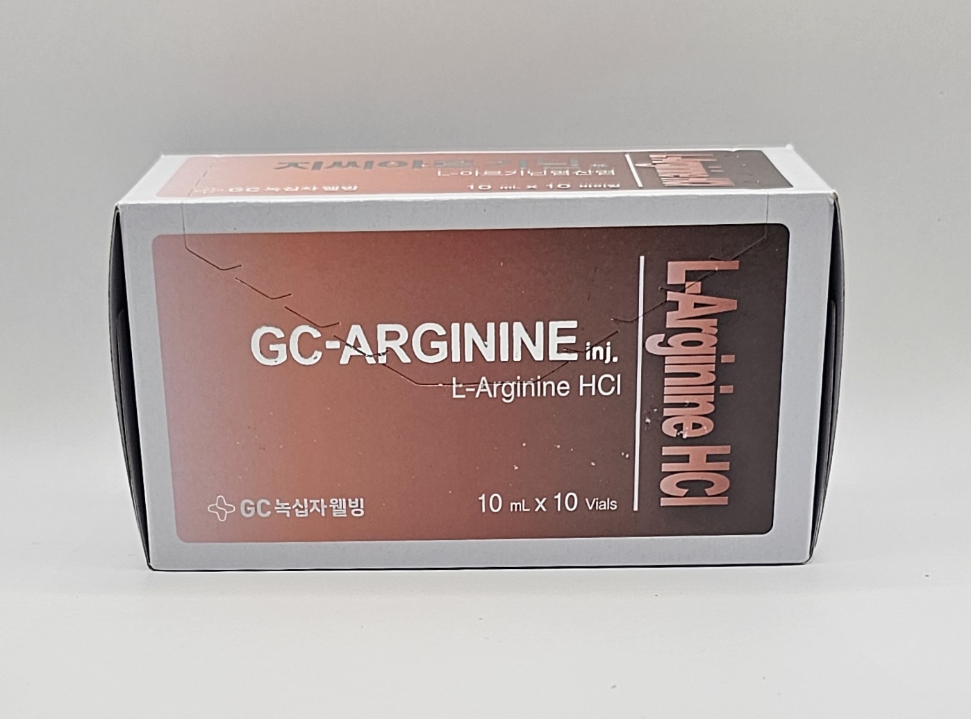 Two l-arginine vials in front of L-arginine box from Vitality Vitamin Vials