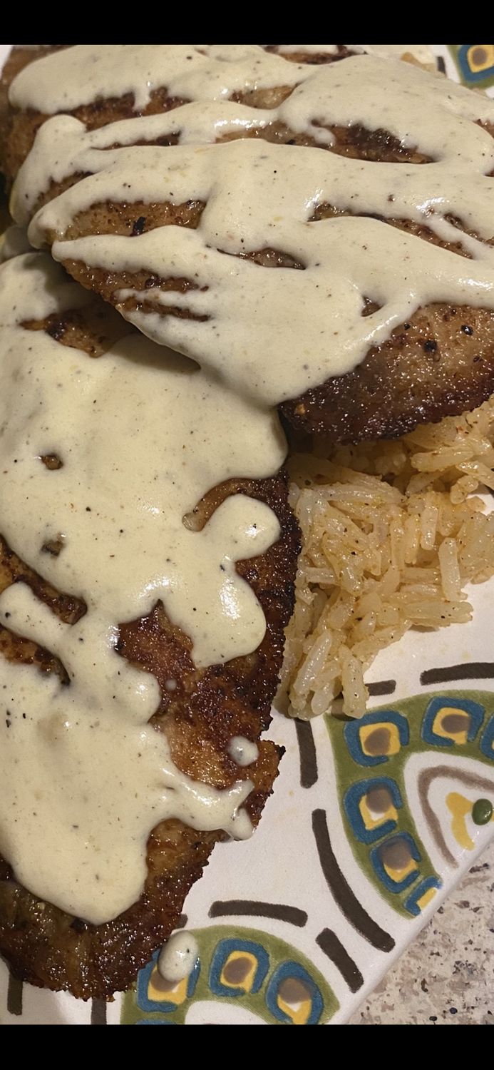 Seared Tilapia Filet w/ Alfredo Sauce Over Seasoned Rice