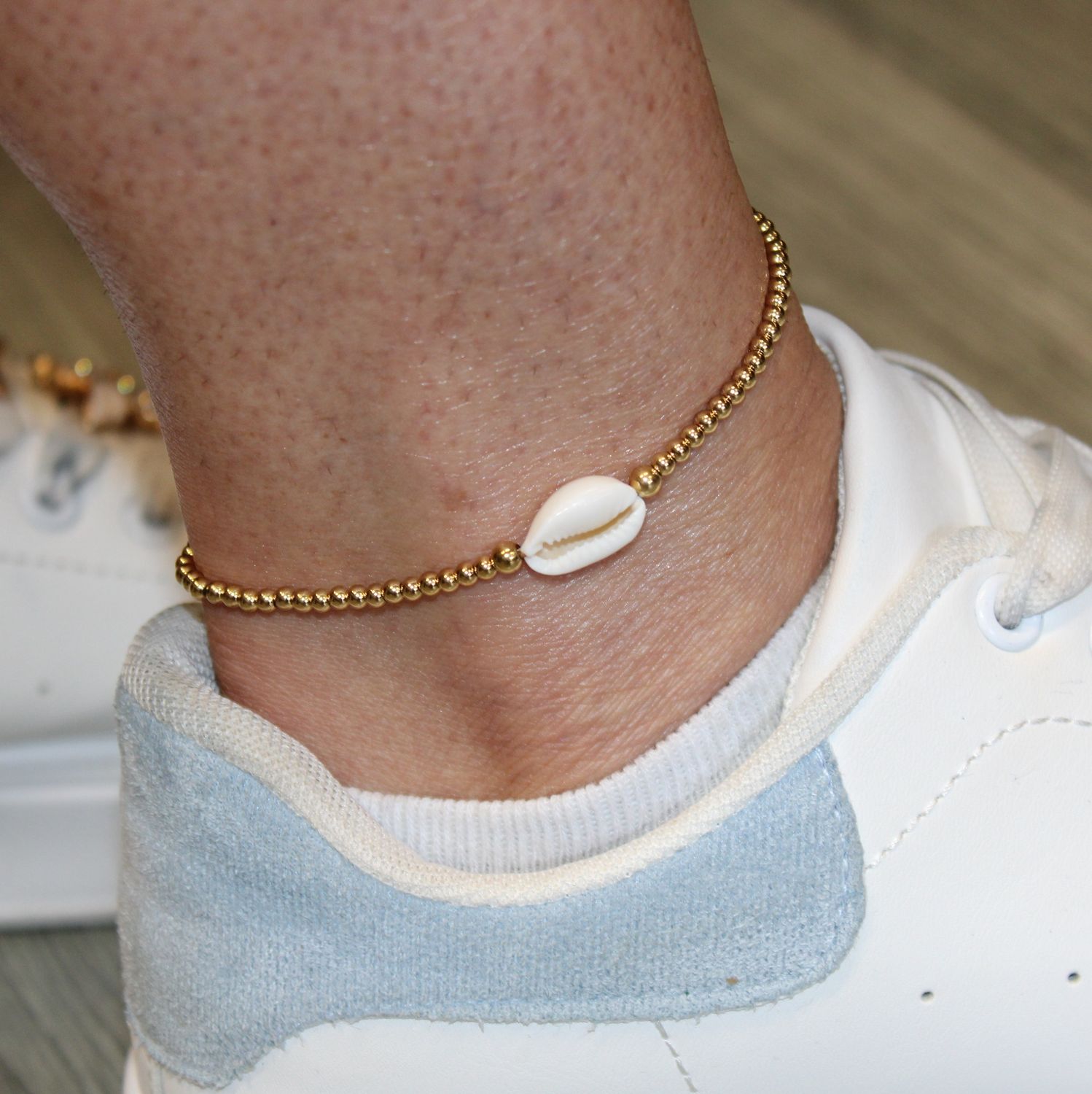 Bracelet de cheville en acier et coquillage