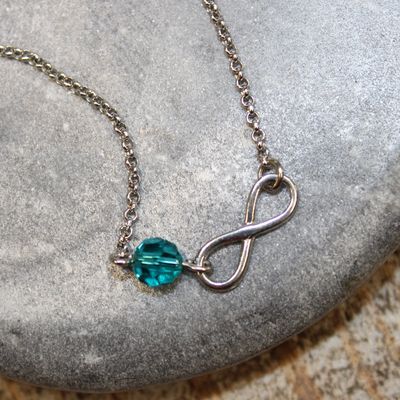 Bracelet infini en argent et cristal pétrole