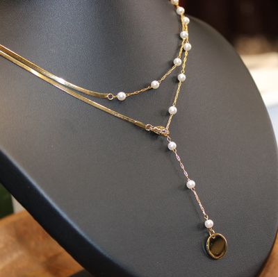 Collier Y double en acier doré et perles